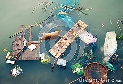 Water pollution with plastic garbage and dirty trash waste Stock Photo