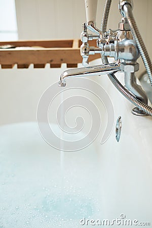 Water poured into the tub. Close up Stock Photo
