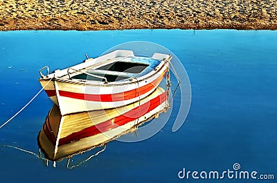 Water reflection of a fishing boat Stock Photo