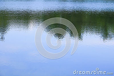 Water reflection with shadow tree and sky in public park Stock Photo