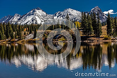 Water reflections with snow capped mountains, San Juan Mountains In Autumn Stock Photo