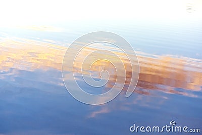 Water ripples. Blue, orange, yellow tints Stock Photo