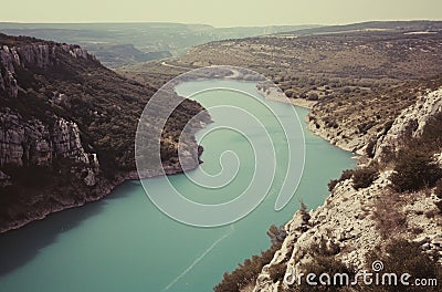 the water of a river with birds swimming in it Stock Photo