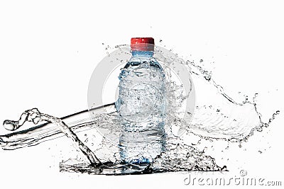 Water. Small plastic water bottle with water drops and splash on Stock Photo