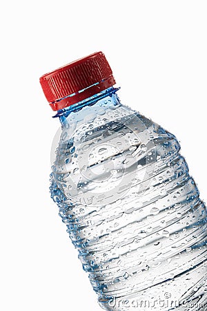 Water. Small plastic water bottle with water drops on white back Stock Photo