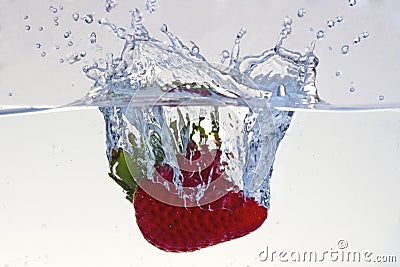 Water splashing on a strawberry Stock Photo