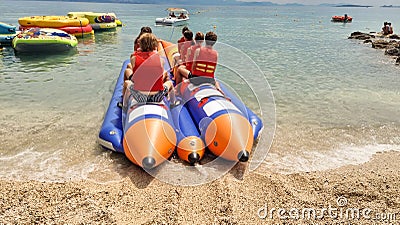water sports in the sea banana boat fun of a group of young tourists Editorial Stock Photo