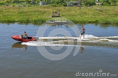 Water sports in summer water skiing on surfboard Editorial Stock Photo