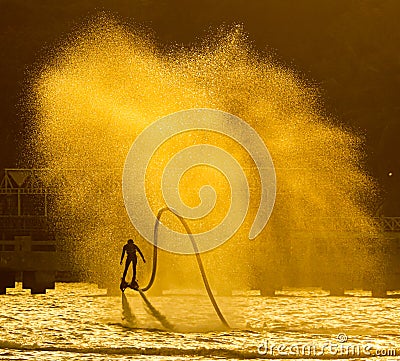 Water spray from flyboard to the sea Stock Photo