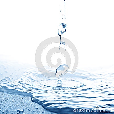 Water spurt before touching surface Stock Photo