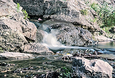 Water stream, long time photo exposure, blue filter Stock Photo