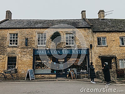 Water stream next to Halt Motoring Museum located in the picturesque village of Bourton on the Water Editorial Stock Photo