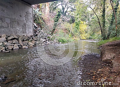 Water streams under a bridge Stock Photo