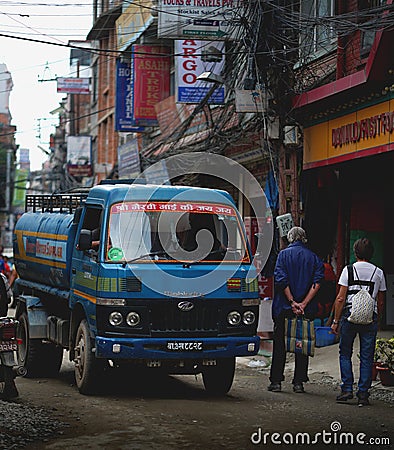 Water Supplier Truck Crossing Crowded Thamel Street. Editorial Stock Photo