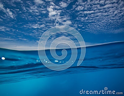 Split shot of blue ocean water surface underwater Stock Photo