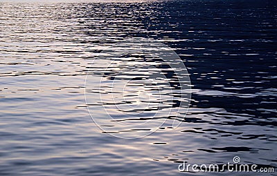 Water surface with wavelets with sunlight reflection Stock Photo