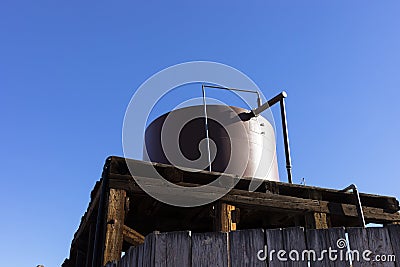 Water Tank, Barrel For Heating Under Sun On Workshop Building Outdoor at Countryside. Hot Stock Photo