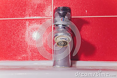 Water tap in detail with limescale close up soiled bathroom Calcified faucet. Stock Photo