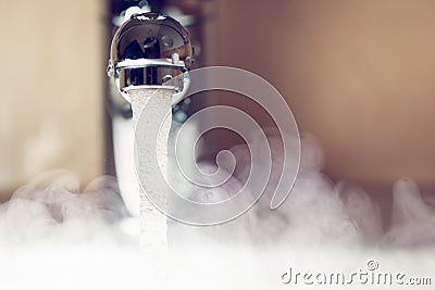 Water tap with hot water steam Stock Photo