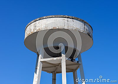 Water tower against the blue sky Stock Photo