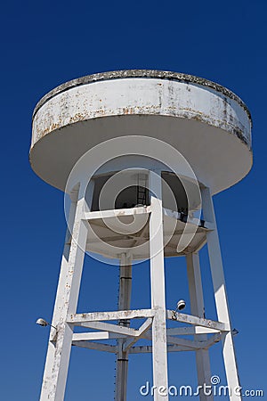 Water tower against the blue sky Stock Photo