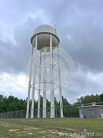 Water Tower and Outbuilding. Stock Photo
