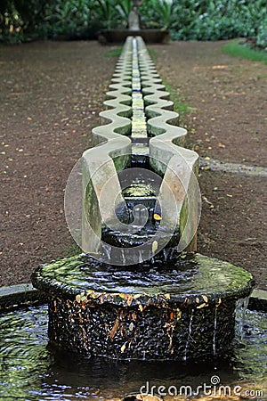 Water trough in Allerton National Tropical Botanical Garden, Kauai Stock Photo