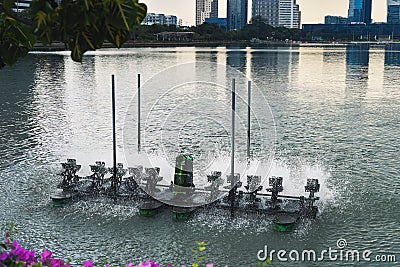 Water turbines (hydraulic turbine) to increase oxygen and purify a fish pond in Bangkok, Thailand Editorial Stock Photo