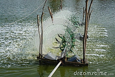 Water Turbines Supplying Fish Pond Stock Photo