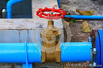 Water valve plumbing joint steel tap pipe with red knob close up Stock Photo