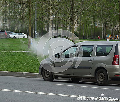 Water vapor from an open car hood on the road Editorial Stock Photo