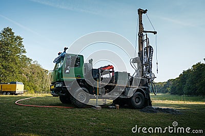 Water well drilling rig preparing to boring dowin into the earth. Stock Photo