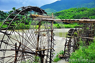Water wheel - a tool of mountan people which take water from river to their field automa PuLuong - so fresh, so cool, really great Stock Photo