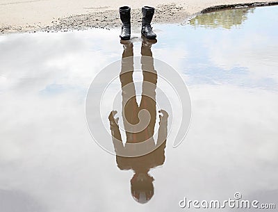 About water are worth moto shoes. In the reflection of the motorcyclist in gear Stock Photo