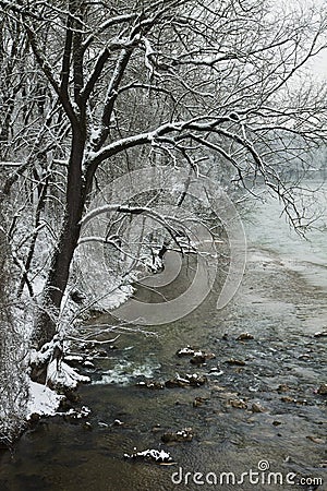 Waterbank of Isar river covered by snow Stock Photo