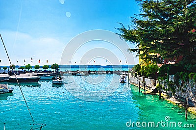 Watercolor drawing of Harbour of Garda lake with blue azure turquoise water Stock Photo