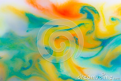 Watercolor mix in milk, color macro abstract. Water drops, oil drops, milk drops, paint drops in green and yellow color Stock Photo