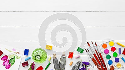 Watercolor paints, brushes for painting, pencils and crayons Stock Photo