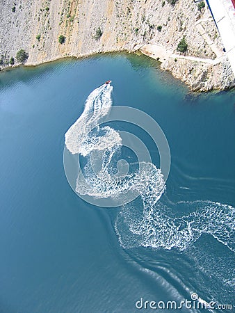 Watercraft leaving trails on the water Stock Photo