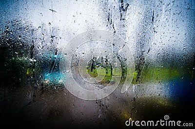 Waterdrops on a glass surface windows with closeup cityscape background Stock Photo