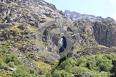 waterfall in the Ala Archa national Park in summer, Kyrgyzstan in Central Asia Stock Photo