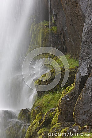 Waterfall and basaltic rocks. Iceland. Seydisfjordur. Stock Photo