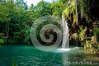 Waterfall and a beautiful lagoon lake for relaxing in the summer Stock Photo