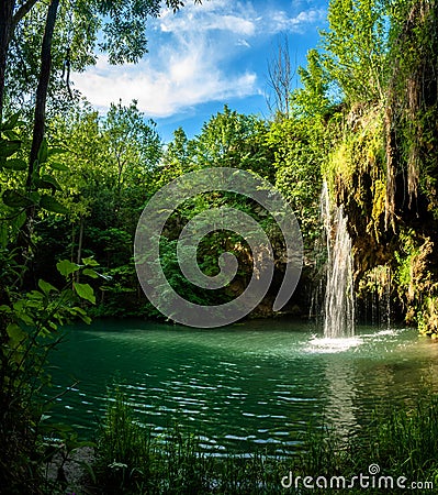 Waterfall and a beautiful lagoon lake for relaxing in the summer Stock Photo