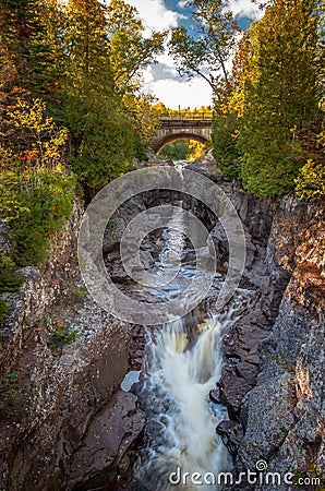 Waterfall Beneath an Arch Stock Photo