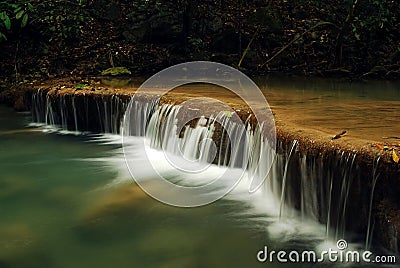 Waterfall with blue stream Stock Photo