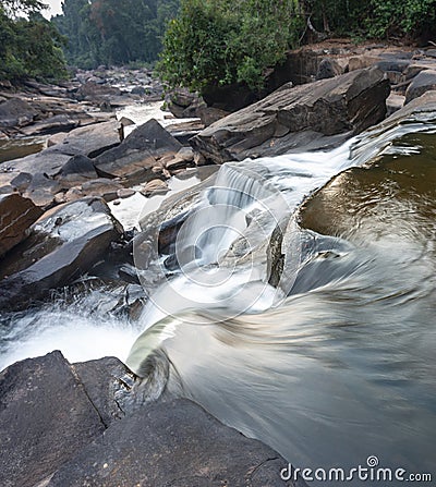Waterfall cascades,over jagged rocks and boulders at Maak Ngaew falls,near Pakse,Southern Laos Stock Photo