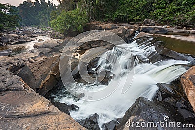 Waterfall cascades,over jagged rocks and boulders at Maak Ngaew falls,near Pakse,Southern Laos Stock Photo