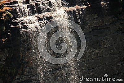WATERFALL CASCADING OVER EDGE OF CLIFF Stock Photo