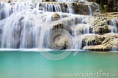 Waterfall cascading over a shelf of rocks Stock Photo